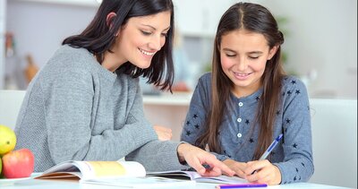 A math tutor helping a student with math homework